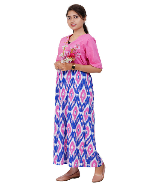 Woman wearing pink dress with flowers in hand