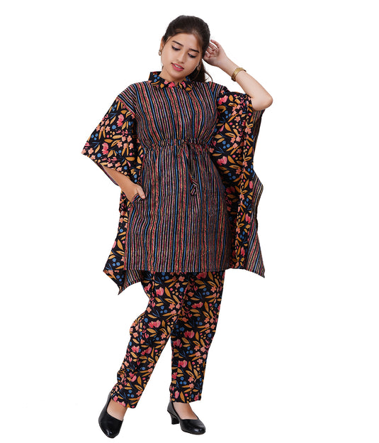 Woman wearing a colorful outfit with a patterned top and pants on a white background