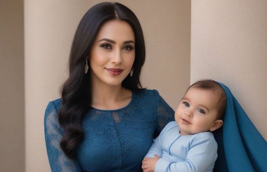 mom wearing blue colored full sleeved modest long dress with a baby 