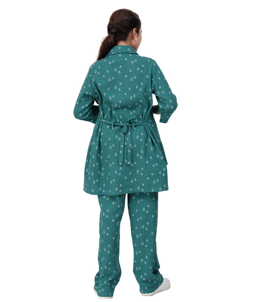 Woman wearing a teal patterned outfit on a white background