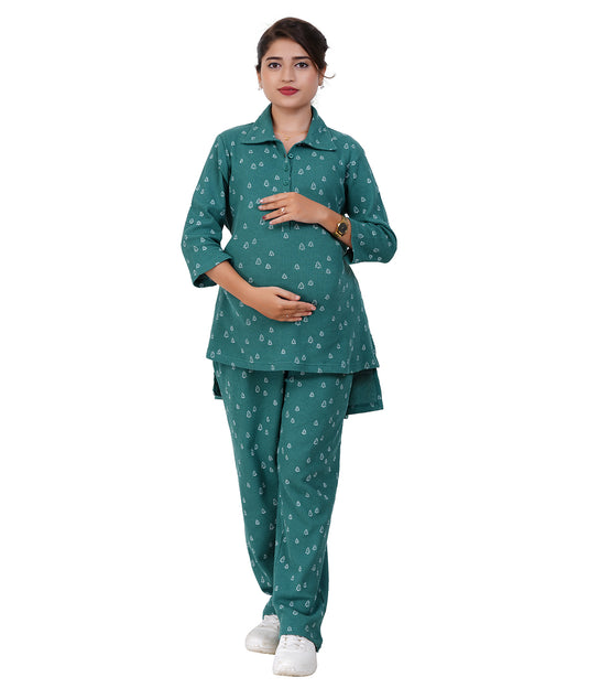 pregnant Woman wearing a teal patterned maternity outfit on a white background