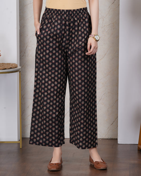 black and gold floral motifs pant with stretchable waistband and pockets.